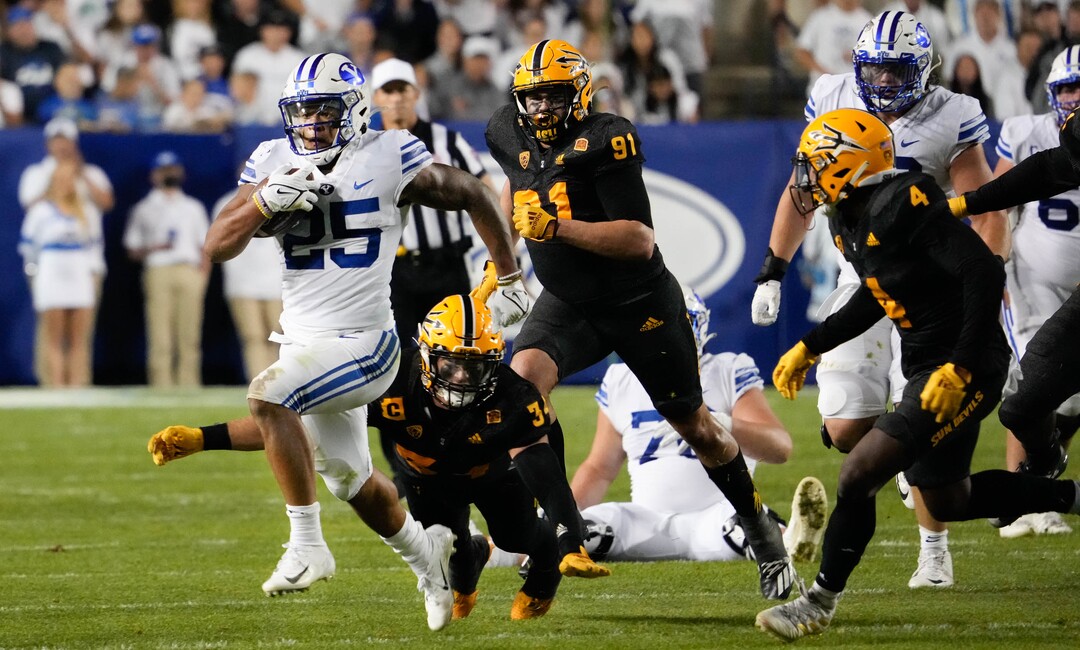 (Francisco Kjolseth | The Salt Lake Tribune) Brigham Young Cougars running back Tyler Allgeier (25) carries the ball against the Arizona State Sun Devils at LaVell Edwards Stadium in Provo, on Saturday, Sept. 18, 2021.