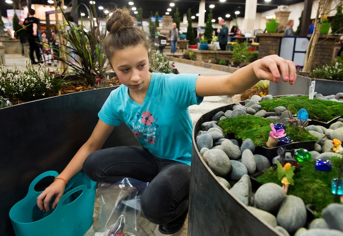 (Rick Egan  |  The Salt Lake Tribune)   Taylor Handy, 12, from Ogden, works on a fairy garden at the Salt Lake Tribune Home & Garden show, at the Mountain America Expo Center in Sandy, Saturday, March 10, 2018. 