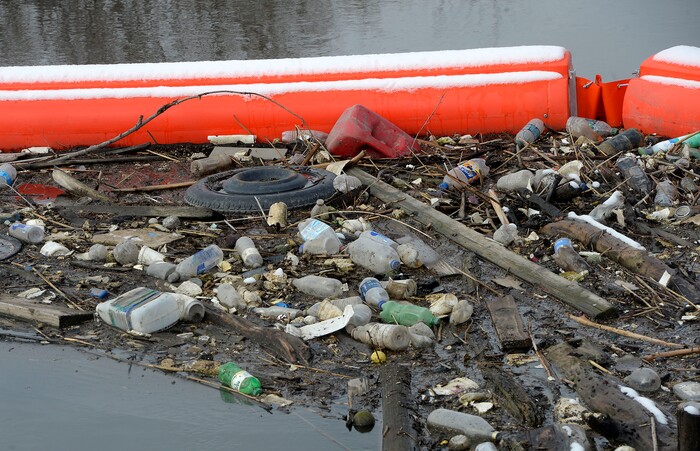 (Al Hartmann | The Salt Lake Tribune)
Booms along the Jordan RIver at about 1700 West and Center Street in North Salt Lake are collecting trash, especially plastic that makes its way down the Jordan River and into the Great Salt Lake where it kills birds. The Natiure Conservency worked with Salt Lake County and private landowners to install the trash-catching booms. They can then be manually cleaned before it reaches the lake.