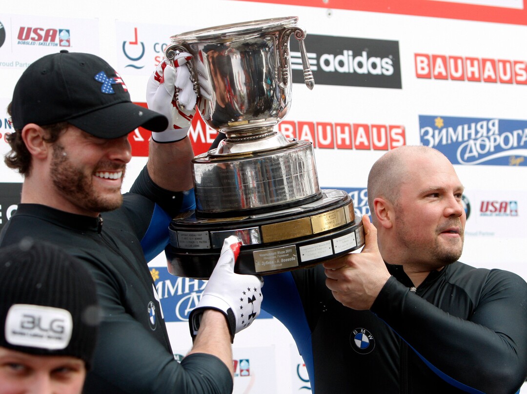 USA's pilot Steven Holcomb, right, and brakeman Steven Langton react after winning the men's two-man bobsled world championships in Lake Placid, N.Y., on Sunday, Feb. 19, 2012. (AP Photo/Mike Groll)