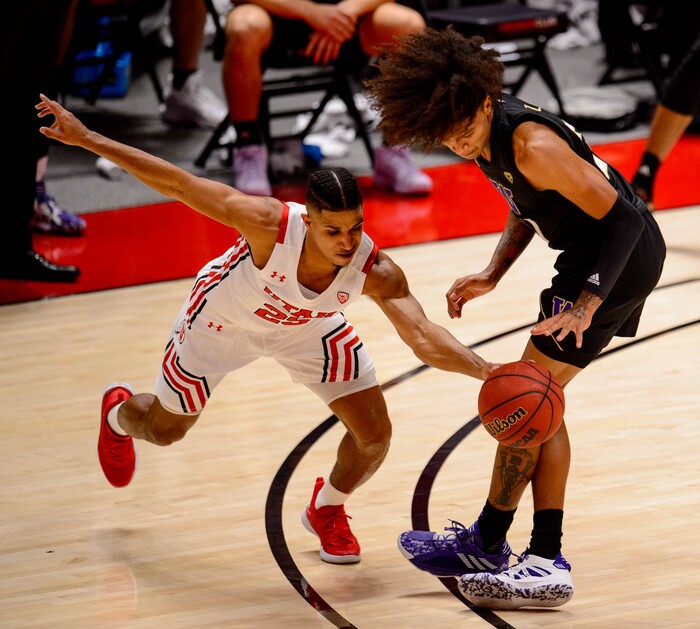 (Trent Nelson | The Salt Lake Tribune) Utah's Alfonso Plummer steals the ball from Washington's Raequan Battle as Utah hosts Washington, NCAA basketball in Salt Lake City on Thursday, Dec. 3, 2020.