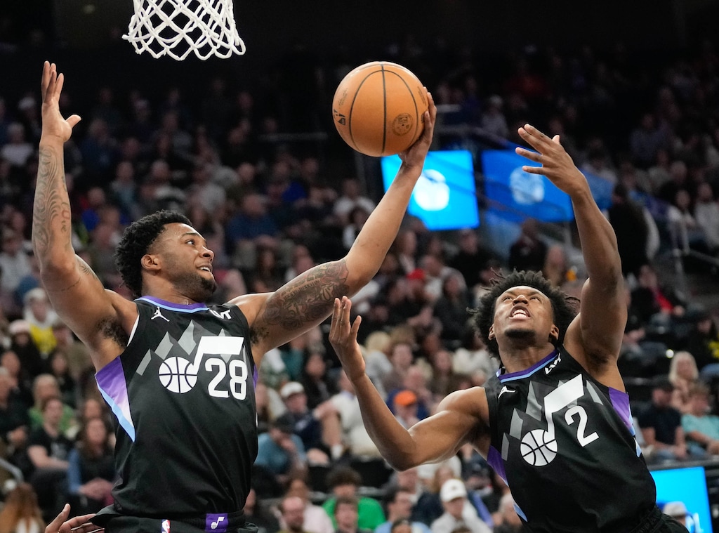 (Francisco Kjolseth | The Salt Lake Tribune) Utah Jazz forward Brice Sensabaugh (28) and Utah Jazz guard Collin Sexton (2) go for a rebound as the Utah Jazz host the Houston Rockets at the Delta Center during an NBA basketball game, Thursday, March 27, 2025.