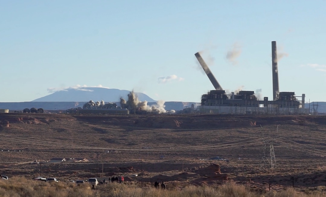 (Zak Podmore | The Salt Lake Tribune) The smokestacks on the Navajo Generating Station coming down on December 18, 2020.