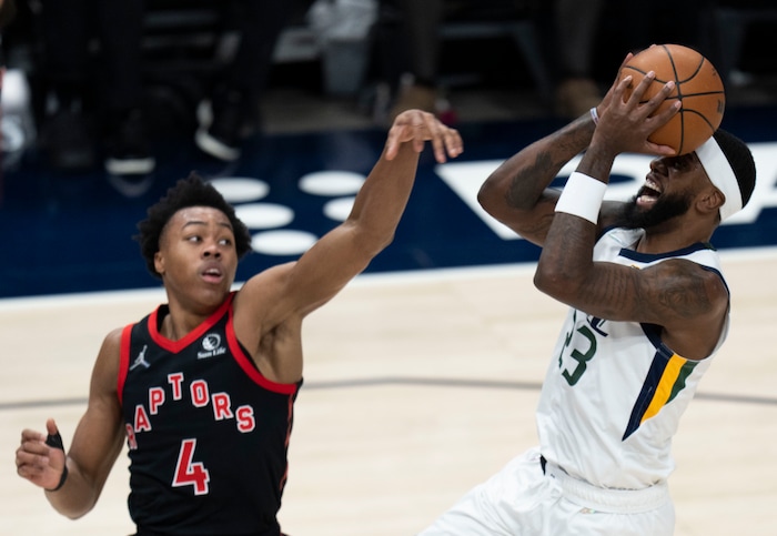 (Rick Egan | The Salt Lake Tribune) Utah Jazz forward Royce O'Neale (23) shoots as Toronto Raptors forward Scottie Barnes (4) defends, in NBA action between Utah Jazz and Toronto Raptors, at Vivint Arena, in Salt Lake City, on  Thursday, Nov. 18, 2021.