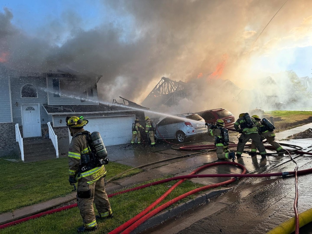 (West Jordan Fire Department via Facebook) Three West Jordan teenagers ran into a burning home Saturday to save two dogs stuck inside, returning them to their owners after they returned minutes later.