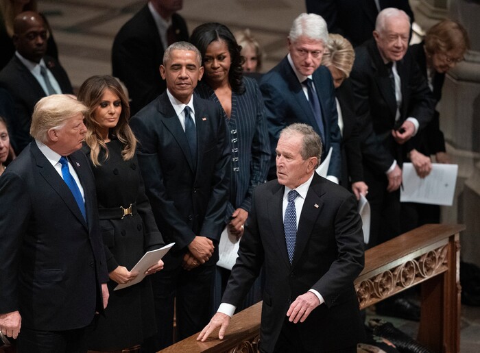 President George W. Bush walks to his seat after greeting President Donald Trump, first lady Melania Trump, former President Barack Obama, Michelle Obama, former President Bill Clinton, former Secretary of State Hillary Clinton, former President Jimmy Carter, and Rosalynn Carter during a State Funeral for former President George H.W. Bush at the National Cathedral, Wednesday, Dec. 5, 2018, in Washington.(AP Photo/Carolyn Kaster)