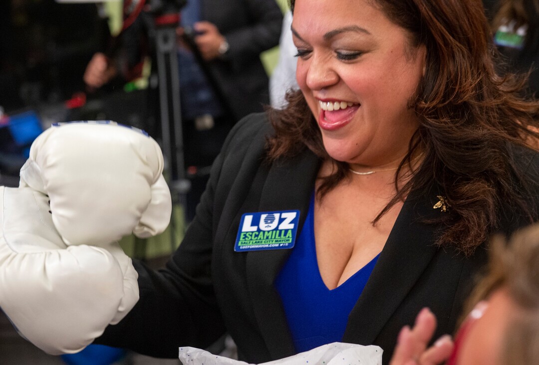 (Rick Egan  |  The Salt Lake Tribune) Salt Lake City mayoral candidate Luz Escamilla thanks opens up a gift of boxing gloves, at her campaign headquarters, Tuesday, Nov. 5, 2019.