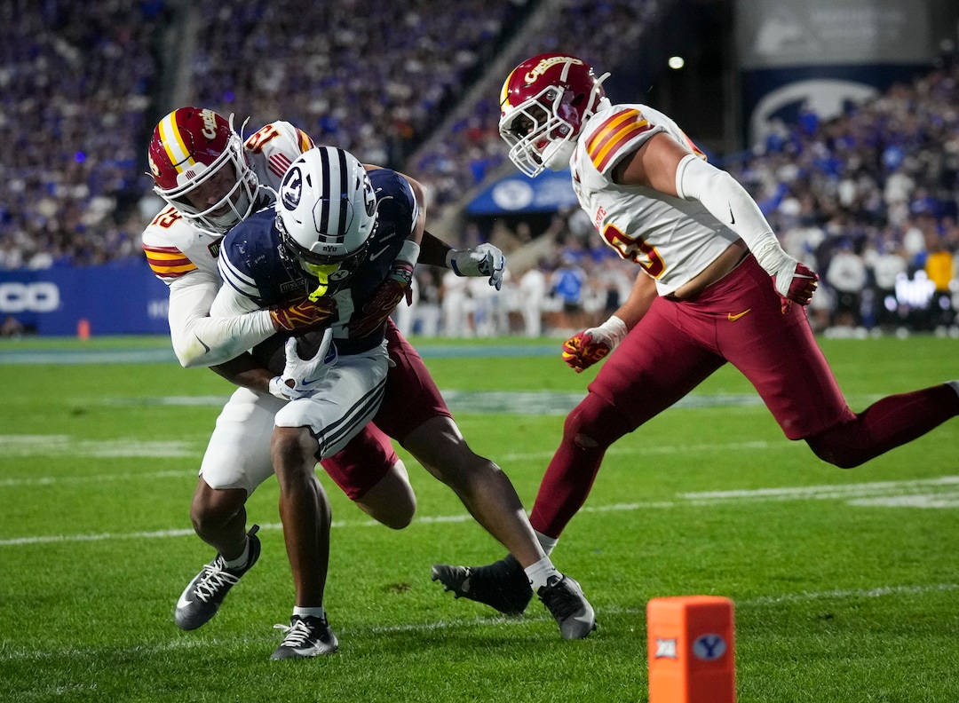 (Bethany Baker  |  The Salt Lake Tribune) Iowa State Cyclones safety Eddie Lemos (19) tackles BYU Cougars wide receiver Legend Glasker (1) assisted by Iowa State Cyclones linebacker Carson Willich (10) during the game between the BYU Cougars and the Iowa State Cyclones in Provo on Friday, Oct. 9, 2026.