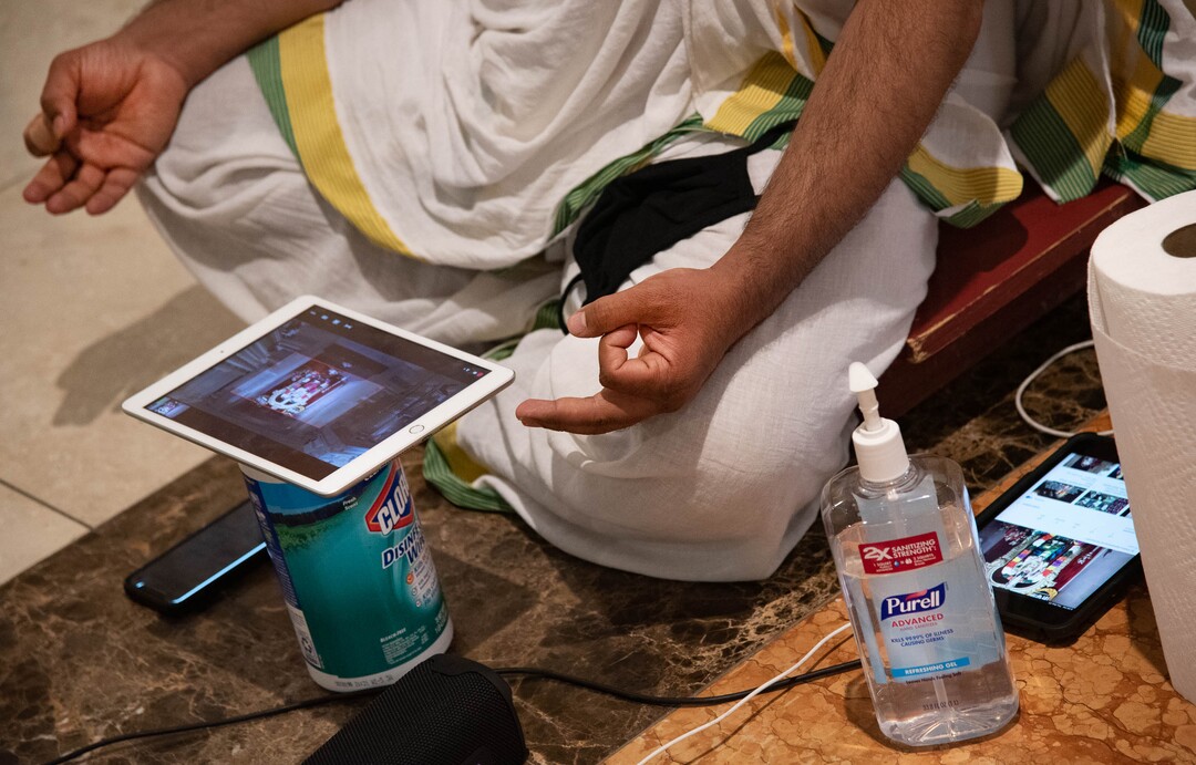 (Francisco Kjolseth  |  The Salt Lake Tribune) The new tools of ceremony, Hindu priest Sathish Nivarthi keeps Clorox wipes and hand sanitizer close while using multiple screen devices to broadcast a ceremony live online on Thursday, Sept. 24, 2020, at the Sri Ganesha Hindu Temple in South Jordan. Due to the coronavirus pandemic the temple remains closed on weekdays with limited time slots available to visit on the weekends in an effort to promote safety.