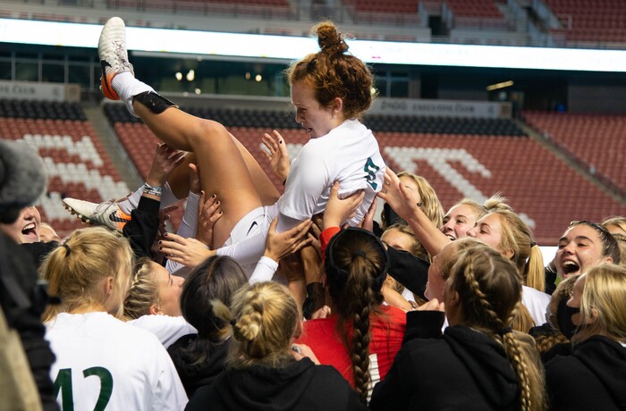 (Francisco Kjolseth  |  The Salt Lake Tribune) Emma Neff #9 of Olympus is is celebrated by teammates following her game winning header in overtime over Bonneville during their 5A high school girls championship game at Rio Tinto Stadium in Sandy on Friday, Oct. 23, 2020. Bonneville won 1-0 in overtime.