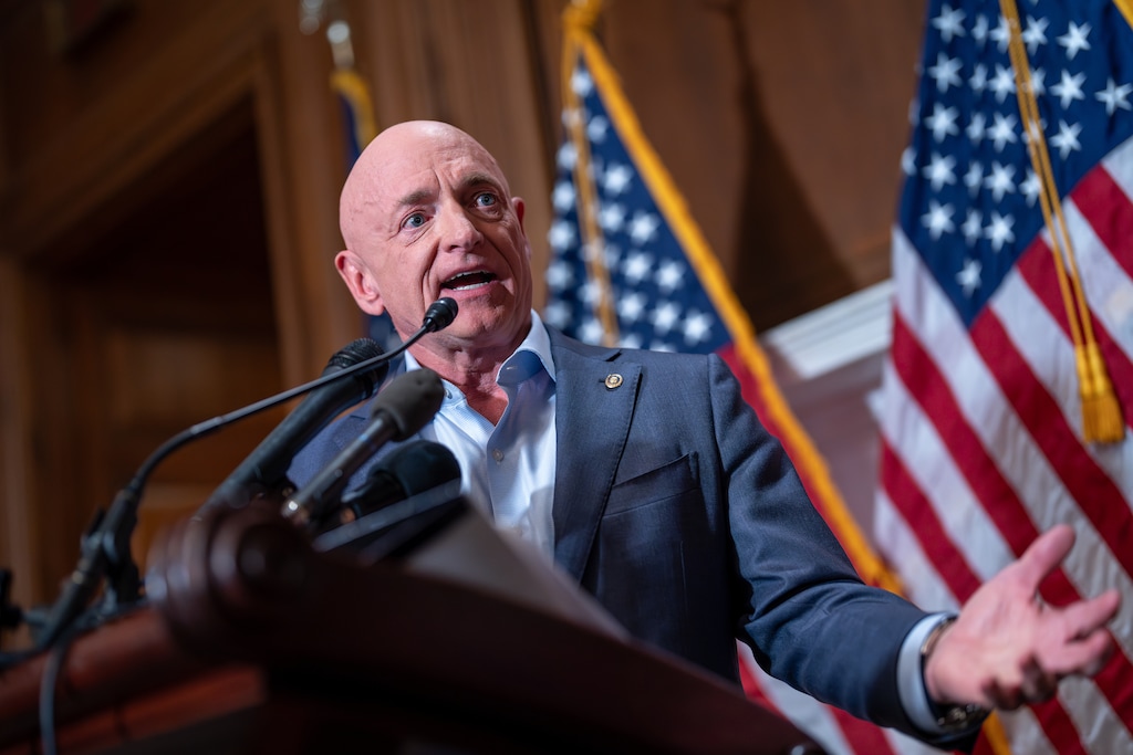 Sen. Mark Kelly, D-Ariz., refutes efforts by President Donald Trump and Defense Secretary Pete Hegseth to intimidate him and other lawmakers after expressing concerns over U.S. military strikes against vessels suspected of smuggling drugs in the Caribbean, during a news conference at the Capitol, in Washington, Monday, Dec. 1, 2025. (AP Photo/J. Scott Applewhite)