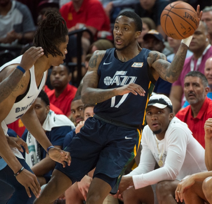 (Rick Egan  |  The Salt Lake Tribune)      Utah Jazz guard Kendrick Ray (17) tosses a pass, as Memphis Grizzlies center Deyonta Davis (21) defends,in Utah Jazz summer league action between Utah Jazz and Memphis Grizzlies in Salt Lake City, Tuesday, July 3, 2018.