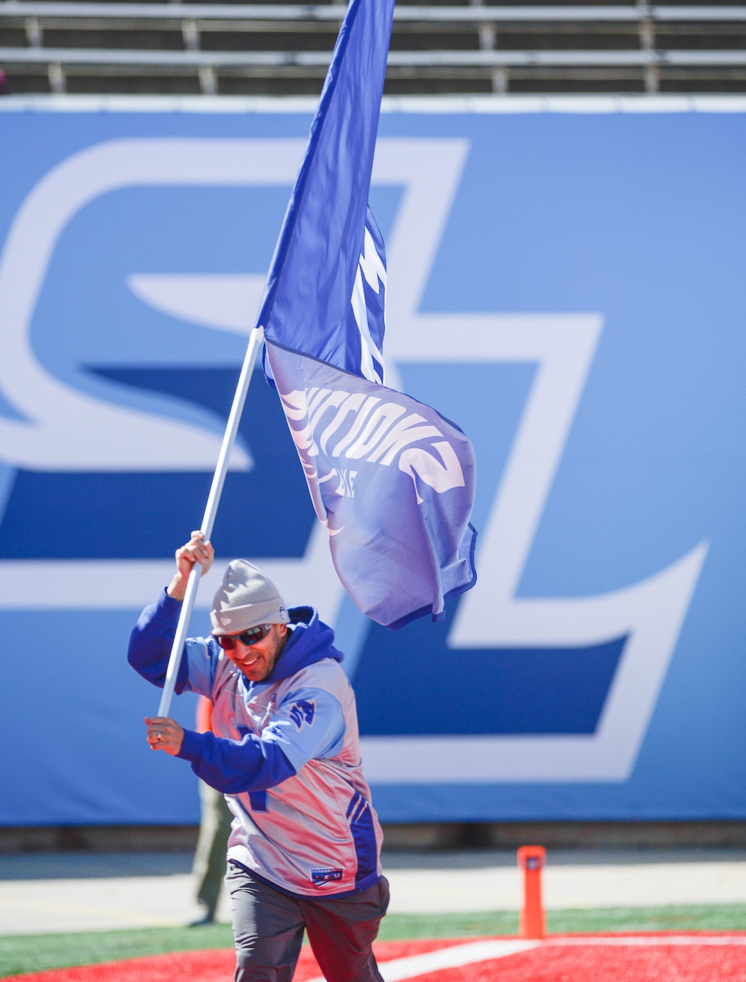 (Francisco Kjolseth  |  The Salt Lake Tribune)  Local Olympic speed skater Derek Parra stays incognito as he runs the Salt Lake Stallions game flag while the team hosts the Memphis Express of the Alliance of American Football in Salt Lake City on Saturday March 16, 2019.