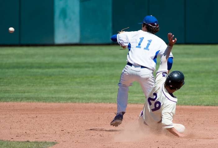 (Rick Egan  |  The Salt Lake Tribune)    Gaige Morris slides into second for Riverton as Joey Dixon, Bingham waits for the throw, in 6A state baseball championship action between Riverton and Bingham, at UVU in Orem, Friday, May 25, 2018.