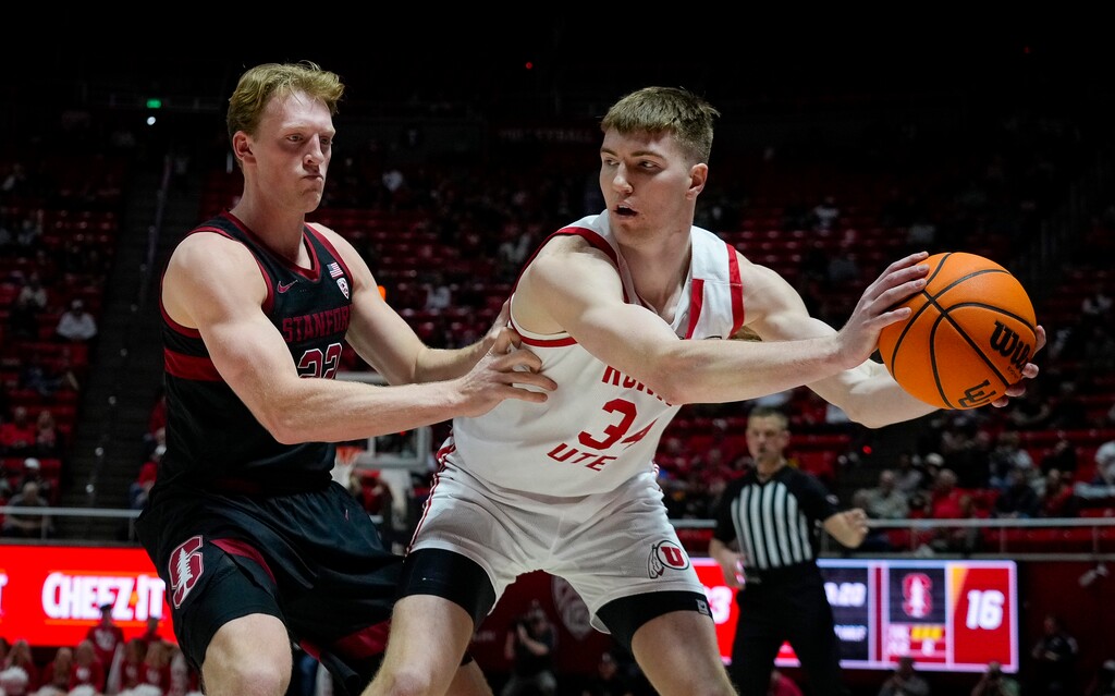(Bethany Baker  |  The Salt Lake Tribune) Utah Utes center Lawson Lovering (34) looks to pass as Stanford Cardinal forward James Keefe (22) defends at Jon M. Huntsman Center in Salt Lake City Thursday, Feb. 29, 2024.