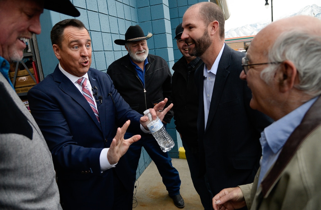 (Francisco Kjolseth | The Salt Lake Tribune) George Zinn, right, shares a moment with former Utah House Speaker Greg Hughes, second from left, at Hughes' 2020 announcement of his run for governor. Hughes remarked on Zinn's penchant for showing up at all manner of political events.