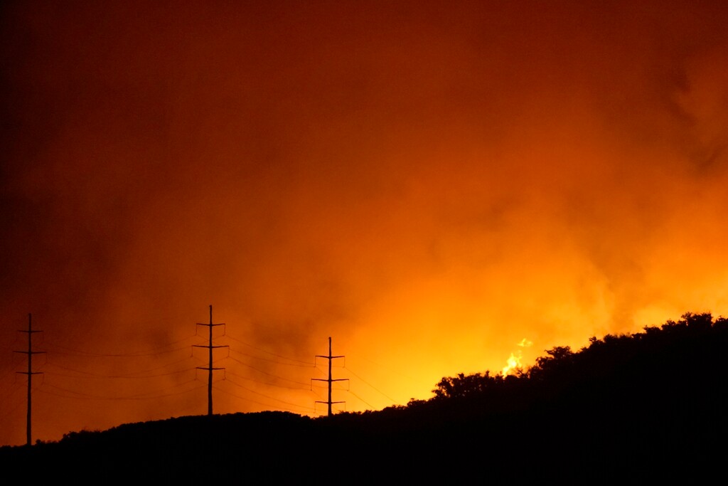 (George Frey | Special to The Tribune) A wildfire burns on Traverse Mountain above Lehi on June 28th, 2020.