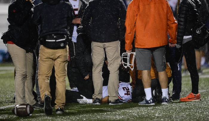 (Francisco Kjolseth  |  The Salt Lake Tribune)  Timpview's  Chandler Sorenson is eventually taken off the field after being injured in the third quarter against Corner Canyon in game action on Thursday, Sept. 21, 2017.