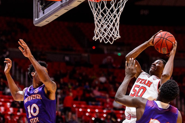 (Trent Nelson | The Salt Lake Tribune)  Utah Utes guard Christian Popoola (50) shoots as the University of Utah hosts Northwestern State, NCAA basketball in Salt Lake City, Wednesday December 20, 2017.