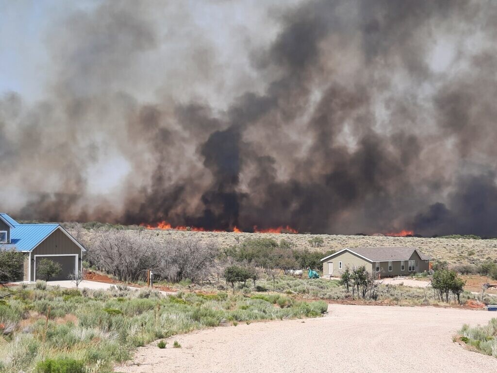 (Marjorie Haun-Storland) The Deer Creek Fire burns on July 10 as seen from Marjorie Haun-Storland’s home in Old La Sal, about a half-mile from the flames.