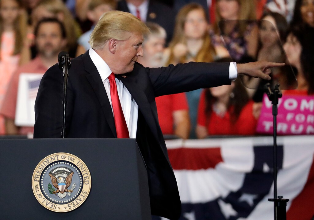 (AP Photo/Mark Humphrey) President Donald Trump points to an audience member as he speaks at a rally at the Nashville Municipal Auditorium Tuesday, May 29, 2018, in Nashville, Tenn.