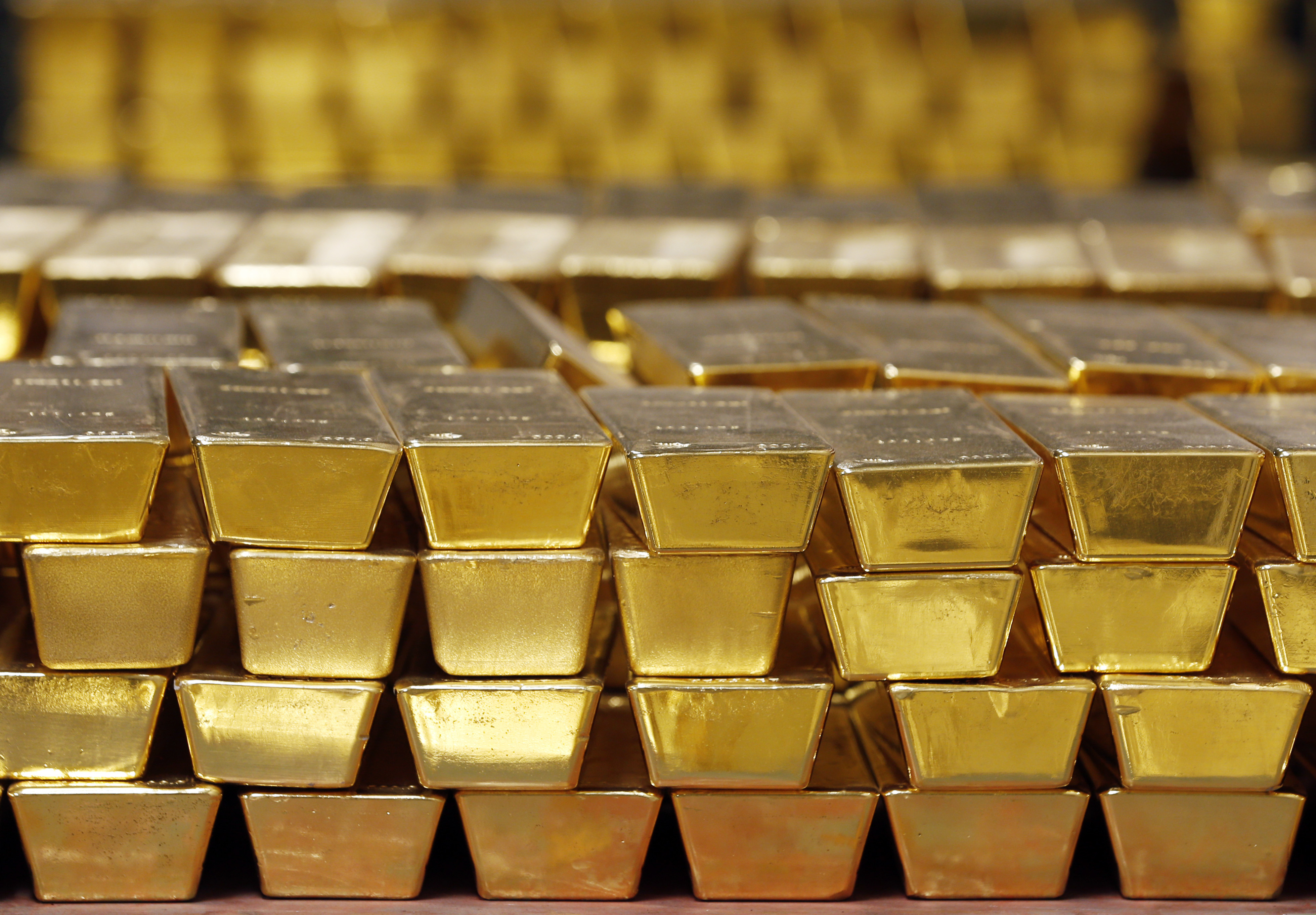 (Mike Groll | AP) Gold bars are stacked in a vault at the United States Mint, in West Point, N.Y. in 2014.