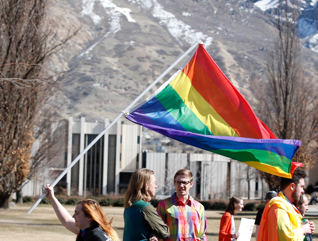 (George Frey  |  special to The Salt Lake Tribune) BYU students and others gather in front of the Ernest L. Wilkinson Student Center on the campus of Brigham Young University to protest BYUÕs rollback of a newly announced policy change on LGBTQ students on March 5, 2020 in Provo, Utah.
