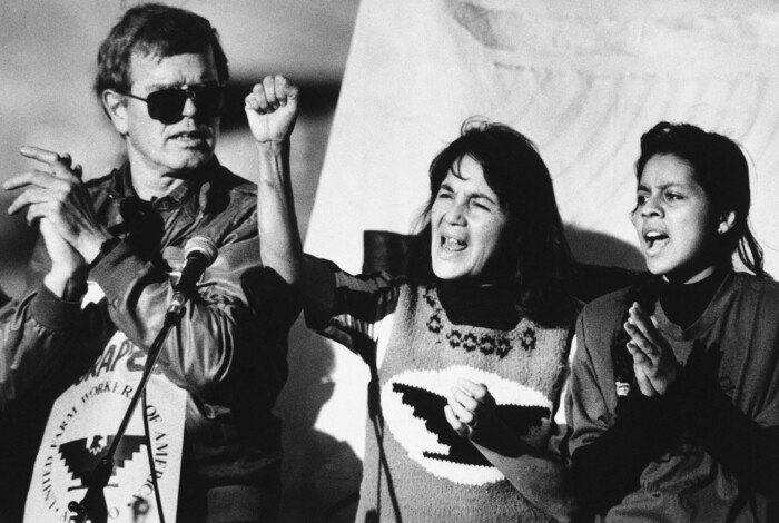 FILE - In this Nov. 19, 1988, file photo, United Farm Workers leader Dolores Huerta, center, leads a rally along with Howard Wallace, President of the San Francisco chapter of the UFW, left, and Maria Elena Chavez, 16, the daughter of Cesar Chavez, right, in San Francisco's Mission District as part of a national boycott of what the UFW claims is the dangerous use of pesticides on table grapes. Huerta, the social activist who formed a farm workers union with César Chávez and whose "Si, Se Puede" chant inspired Barack Obama's 2008 presidential campaign slogan, is the subject of a new PBS documentary. The film "Dolores" examines the life of the New Mexico-born Mexican-American reformer from her time as a tireless United Farm Workers leader and a campaign volunteer for Sen. Robert Kennedy's 1968 presidential run. (AP Photo/Court Mast, File)