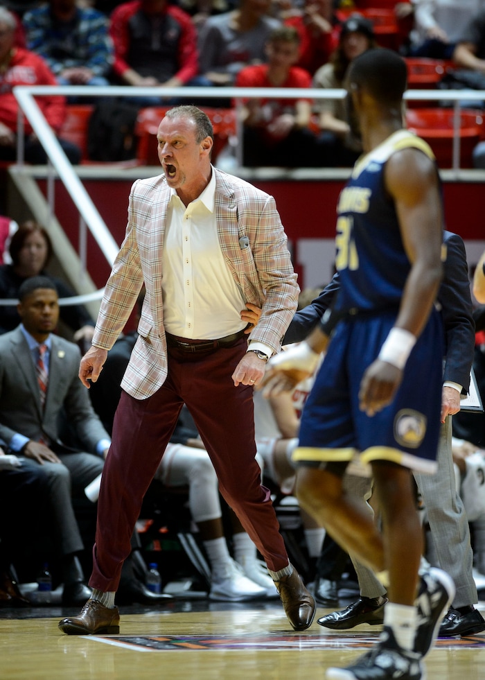 (Steve Griffin  |  The Salt Lake Tribune) University of Utah head coach Larry Krystkowiak storms onto the court after a foul was called on his team during the Utah versus UC Davis men's NIT basketball game at the Huntsman Center in Salt Lake City Wednesday March 14, 2018. Krystkowiak was ejected from the game.