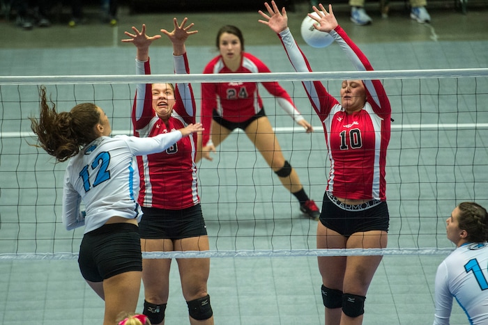 (Chris Detrick  |  The Salt Lake Tribune)  Sky View's Dawson Day (12) spikes past Park City's Emily Smith (6) and Park City's Bella Buchanan (10) during the the 4A volleyball state championships at the UCCU Center at Utah Valley University Thursday, October 26, 2017.  