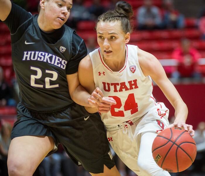 (Rick Egan  |  The Salt Lake Tribune)       Utah Utes guard/forward Tilar Clark (24), takes the ball inside, as Washington Huskies forward Khayla Rooks (22) defends, in PAC-12 women's basketball action at the Jon M. Huntsman Center, Sunday, Feb. 18, 2018.