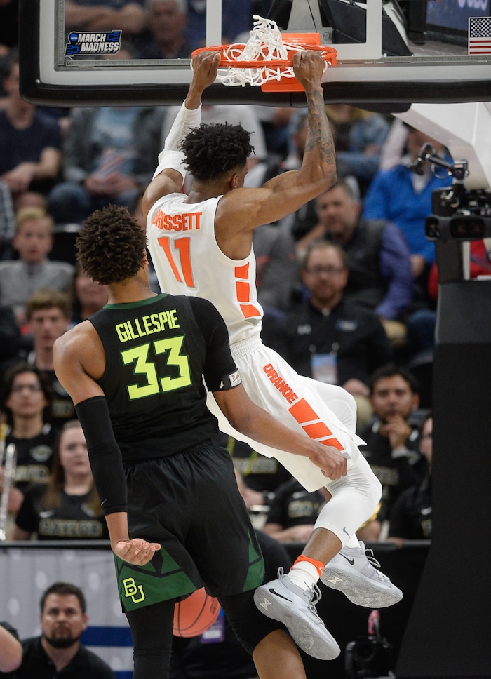 (Francisco Kjolseth  |  The Salt Lake Tribune)  Syracuse Orange forward Oshae Brissett (11) dunks one in past Baylor Bears forward Freddie Gillespie (33) as Syracuse faces Baylor in their first round menÕs NCAA March Madness tournament game at Vivint Smart Home Arena in Salt Lake City on Thursday, March 21, 2019.