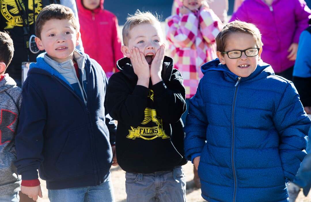 (Rick Egan  |  The Salt Lake Tribune) First graders Diego Sosa,Tate Meacham, and Jax Garner react as Santa and Mrs. Claus arrive in a helicopter, at Centennial Elementary School, in Roosevelt, Utah, as volunteer pilots from the Utah Wing of Angel Flight West,  brought school supplies and gifts to students  on their annual Santa Flight. Friday, December 8, 2017.