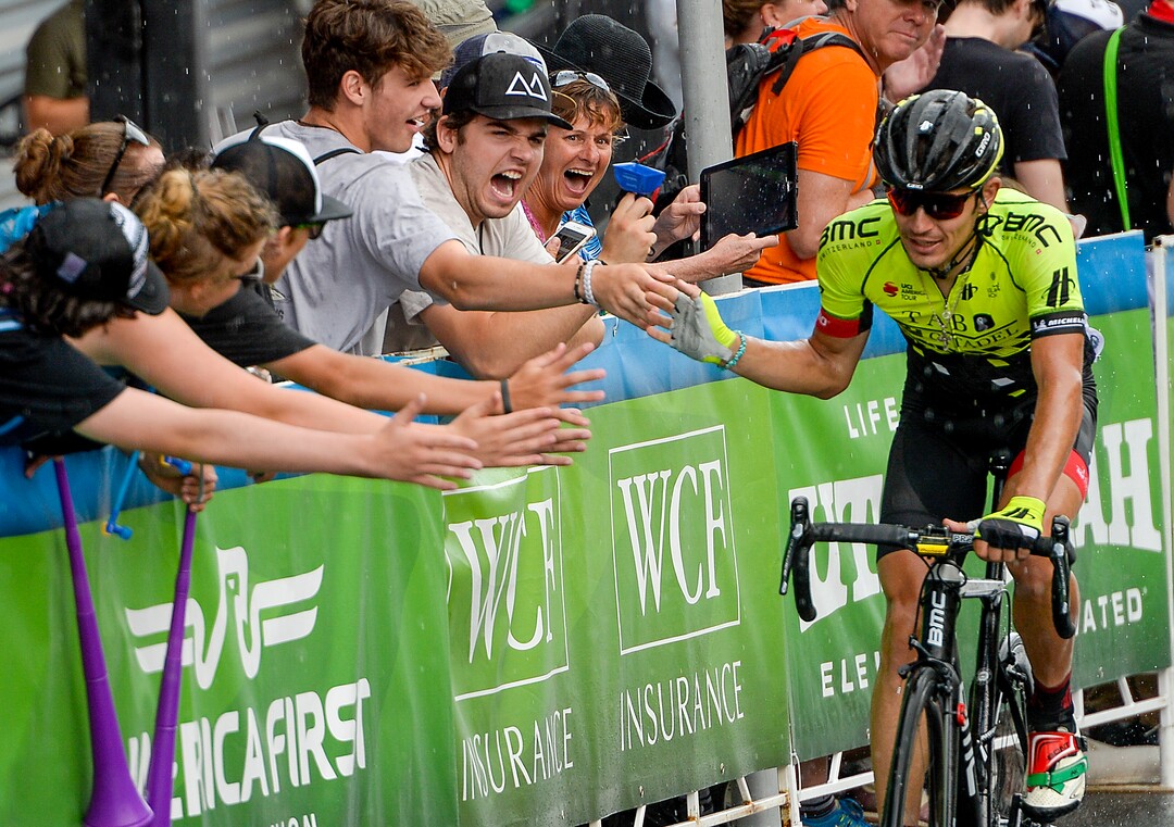 Leah Hogsten  |  The Salt Lake Tribune   Andrei Krasilnikau with team Holowesko Citadel Arapahoe slaps the hands of fans lining Park City's Main Street at the finish of the Tour of Utah's Stage 6, Sunday, August 12, 2018.  