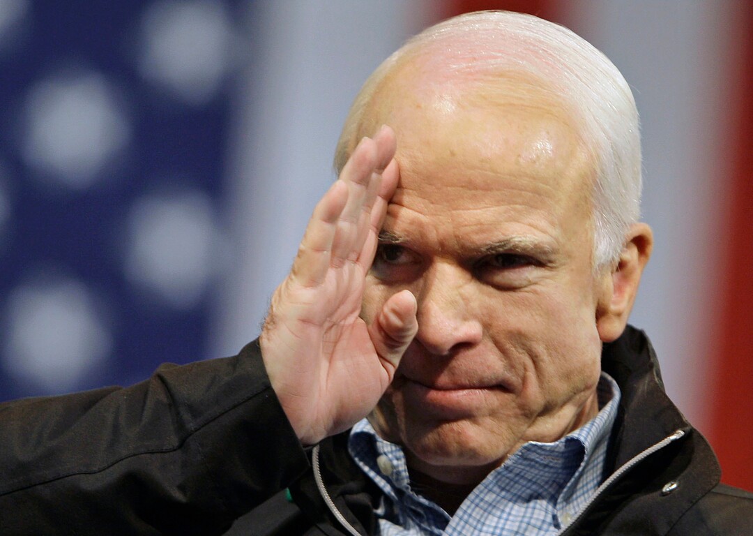 FILE - In this Oct. 30, 2008 file photo, Republican presidential candidate Sen. John McCain, R-Ariz., salutes to the crowd at a rally at Mentor High School in Mentor, Ohio. McCain's family says the Arizona senator has chosen to discontinue medical treatment for brain cancer.   (AP Photo/Carolyn Kaster)
