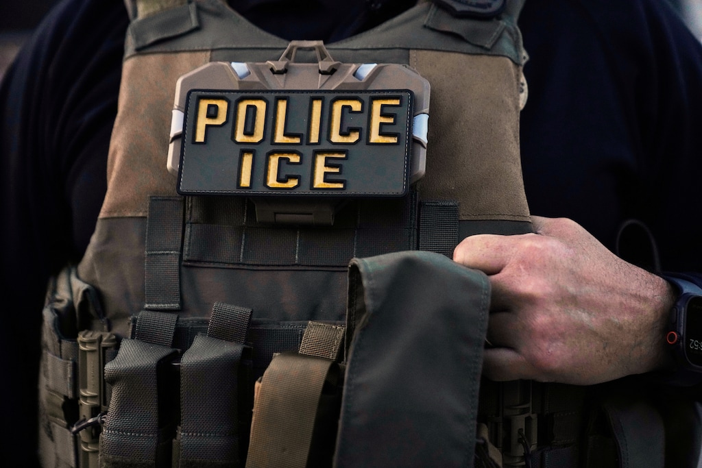 (Erin Hooley | AP)  A U.S. Immigration and Customs Enforcement agent is seen in Park Ridge, Ill., Sept. 19, 2025.