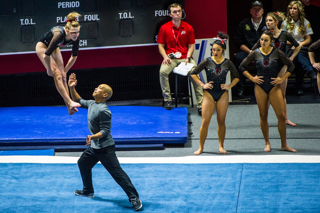 Chris Detrick  |  The Salt Lake TribuneCo-Head Coach Tom Farden helps Utah gymnast MaKenna Merrell performs her floor routine during the Red Rocks Preview at the Huntsman Center Friday December 11, 2015.  