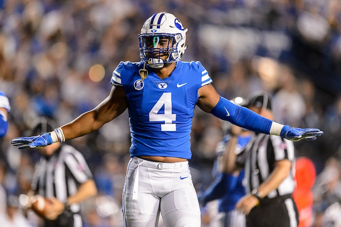 (Trent Nelson | The Salt Lake Tribune)  Brigham Young Cougars linebacker Fred Warner (4) tries to calm the crowd after a Utah interception as BYU hosts Utah, NCAA football in Provo, Saturday September 9, 2017.
