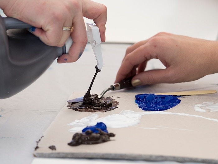 (Leah Hogsten  |  The Salt Lake Tribune)  Only three colors of acrylic paint were given to students in brown, blue and white during the Bob Ross Paint-Along class, Saturday, January 6, 2018 at the Salt Lake City Public Library's Sweet Branch in the Avenues. 
