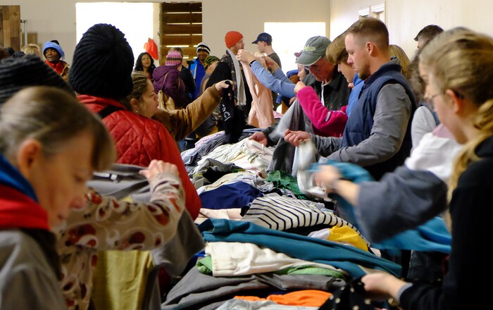 (Francisco Kjolseth | The Salt Lake Tribune) Volunteers help people in need sort through clothes at the Salt Lake City Mission at 1055 North Redwood Road in Salt Lake City, prior to a Thanksgiving banquet for the homeless and the hungry on Thursday, Nov. 28, 2019.