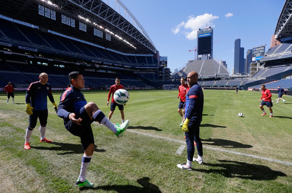 U.S. national soccer team goalkeepers Brad Guzan, left, Nick Rimando, center, and left, Tim Howard, center right, kick around with teammates at the start of a practice session Monday, June 10, 2013, in Seattle. The U.S. will face Panama on Tuesday, June 11, 2013, for a World Cup qualifier soccer match. (AP Photo/Ted S. Warren)