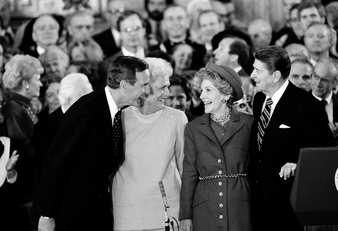 FILE - In this Jan. 21, 1985, file photo, U.S. President Ronald Reagan and his wife, Nancy, right, stand with Vice President George Bush and Barbara Bush following the oaths in the Capitol Building in Washington. A family spokesman said Tuesday, April 17, 2018, that former first lady Barbara Bush has died at the age of 92. (AP Photo/Bob Daugherty, File)