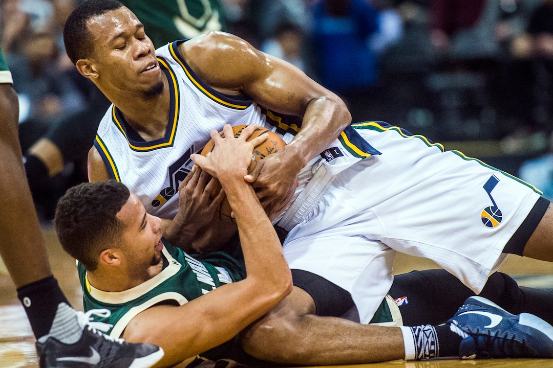 Chris Detrick  |  The Salt Lake TribuneUtah Jazz guard Rodney Hood (5) and Milwaukee Bucks guard Michael Carter-Williams (5) fight for the ball during the game at Vivint Smart Home Arena Friday February 5, 2016. 