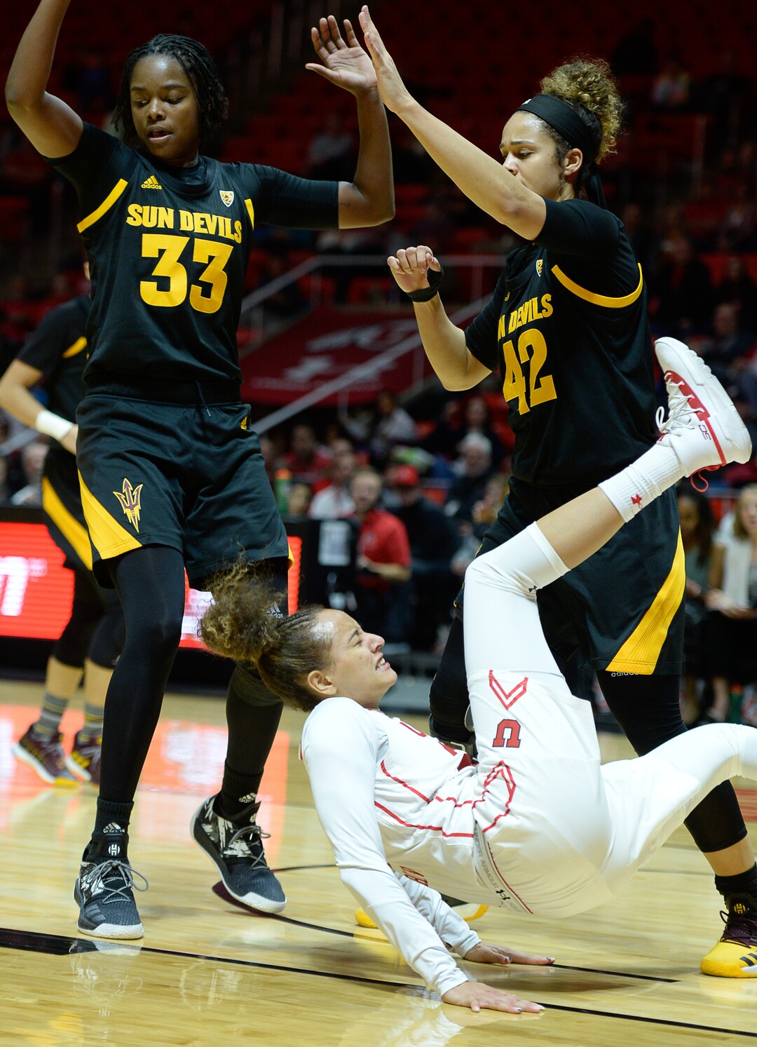 (Francisco Kjolseth  |  The Salt Lake Tribune)  Utah Utes guard/forward Daneesha Provo (23) takes a hard hit that injures her knee while battling ASU in Utes' Pac-12 home opener at the Jon M Huntsman Center on Friday, Jan. 4, 2019. Off to one of their best starts in team history, their twelve in a row winning streak came to an end losing to the Sun Devils 63-65.