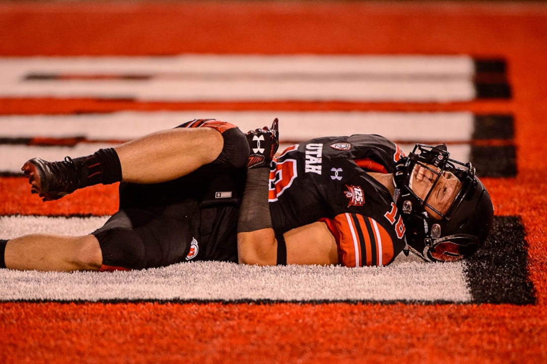 (Trent Nelson | The Salt Lake Tribune)  Utah Utes wide receiver Britain Covey (18) on the ground after leaping for the ball in the end zone as the University of Utah hosts Washington at Rice-Eccles Stadium in Salt Lake City, Saturday Sept. 15, 2018.