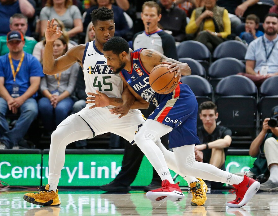 Utah Jazz guard Donovan Mitchell (45) defends against Adelaide 36ers guard Ramone Moore during the first half of an NBA exhibition basketball game Friday, Oct. 5, 2018, in Salt Lake City. (AP Photo/Rick Bowmer)