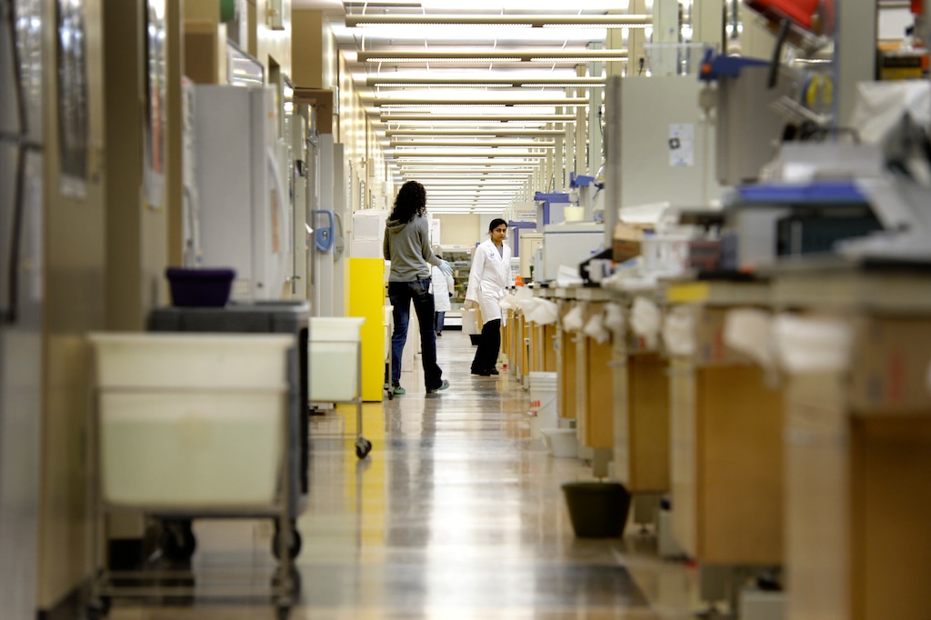 (Tribune file photo) Researchers walk in one of the huge research labs at the Huntsman Cancer Institute. The institute will name its new Proton Therapy Center, set to open in 2020, after retiring Sen. Orrin Hatch.