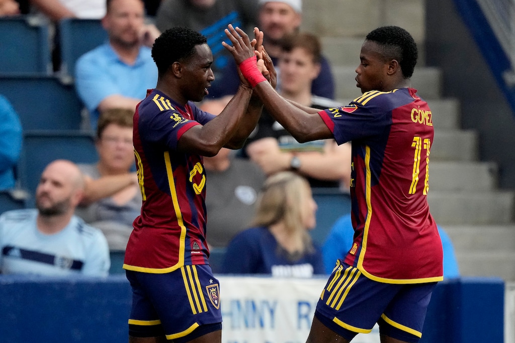 (Charlie Riedel | AP) Real Salt Lake attacker Anderson Julio, left, celebrates with forward Andrés Gómez (11) after scoring a goal during the first half of an MLS soccer match against Sporting Kansas City Wednesday, June 19, 2024, in Kansas City, Kan.