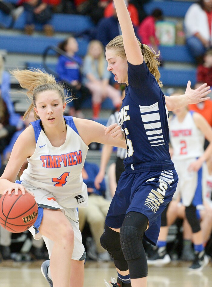 (Leah Hogsten  |  The Salt Lake Tribune)  Timpview's Ella Pope (04) tries to round Skyline's Madison Grange (25). Timpview defeated Skyline 56-49 in their semifinal game of the 5A High School Girls' Basketball Tournament at SLCC in Taylorsville, Friday, Feb. 23, 2018. 