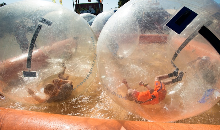 (Rick Egan  |  The Salt Lake Tribune)   Tesla Thomas, 9 of American Fork, rested in side a giant plastic bubble, at the Utah State Fair, Sunday, September 10, 2017.


